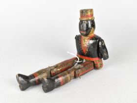 A 19th Century Handmade and Painted Articulated Wooden Peg Doll in the Form of a Soldier, Incomplete