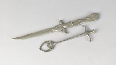 A Continental Pewter Letter Opener in the form of a Floral Mounted Dagger together with a Sugar Cube
