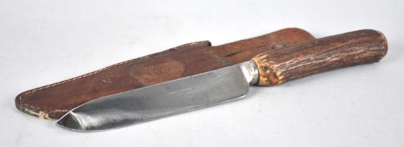 A Vintage Hunting Knife in Leather Scabbard, Blade Inscribed Thomas Wood & Son, Chester, Bone