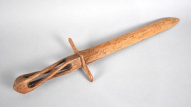 A Hand Carved Wooden Letter Opener in the Form of a Dagger with Pierced Handle, 35cms Long