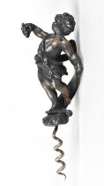 A Patinated Bronze Novelty Corkscrew, the Handle in the Form of a Cherub Carrying a Bunch of Grapes,