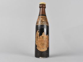 A Novelty Clothes Brush in the Form of a Bottle of Guinness Stout, 21.5cm