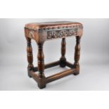 A 19th Century Oak Peg Jointed Stool with Carved Sides on Turned Wooden Supports United by Box