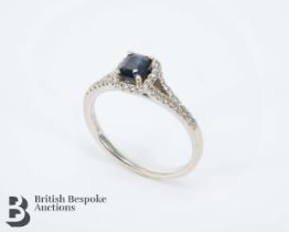 Beaverbrooks 18ct White Gold Sapphire and Diamond Halo Ring