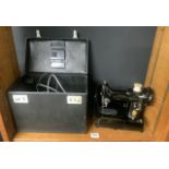 A SINGER FEATHERWEIGHT 222K ELECTRIC SEWING MACHINE WITH ACCESSORIES AND BLACK TRAVEL CASE