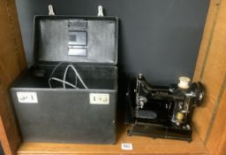 A SINGER FEATHERWEIGHT 222K ELECTRIC SEWING MACHINE WITH ACCESSORIES AND BLACK TRAVEL CASE