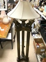 BRONZED METAL AND RESIN STANARD LAMP AS THREE COLUMN SUPPORTS WITH THREE KNEELING LIONS BOUGHT