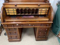 VICTORIAN CYLINDER DESK IN MAHOGANY WITH FALL FRONT ENCLOSING A BIRDS EYE MAPLE FITTED INTERIOR WITH