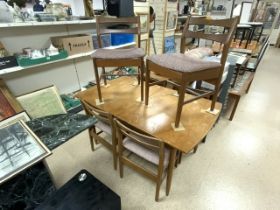 MID-CENTURY MODERN TEAK EXTENDING DINING TABLE WITH SIX MATCHING CHAIRS