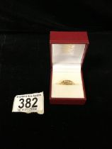 18 CARAT GOLD RING DECORATED WITH FIVE DIAMONDS SIZE K