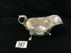 HALLMARKED SILVER SAUCEBOAT WITH SCROLL HANDLE ON HOOF FEET DATED 1936 BY S BLACKENSEE & SON LTD