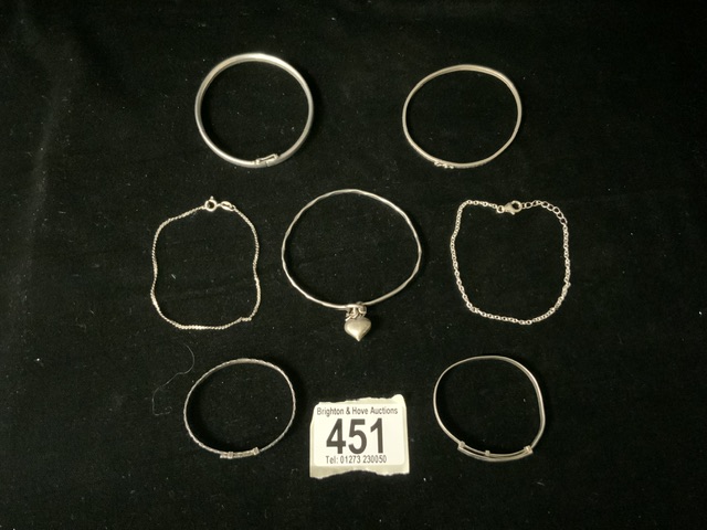 925 AND WHITE METAL ITEMS INCLUDES THREE ADULT BANGLES WITH TWO CHILDRENS BANGLES AND TWO BRACELETS