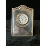 HALLMARKED SILVER FRAMED BEDSIDE CLOCK WITH CIRCULAR DIAL AND BEADED BORDER WITH QUARTZ MOVEMENT
