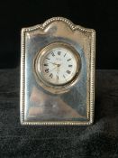 HALLMARKED SILVER FRAMED BEDSIDE CLOCK WITH CIRCULAR DIAL AND BEADED BORDER WITH QUARTZ MOVEMENT