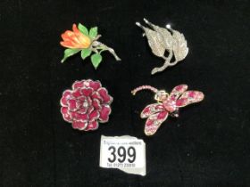 FOUR ENAMEL AND WHITE METAL DECORATIVE BROOCHES