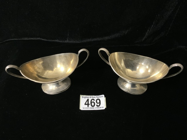 A PAIR OF EDWARDIAN STERLING SILVER SALT CELLARS BY WILLIAM HUTTON & SONS; SHEFFIELD 1909; OVAL