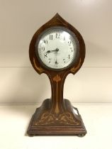 MAHOGANY EIGHT DAY BALLOON SHAPED CASE CLOCK WITH ART NOUVEAU INLAY AND BRASS BUN FEET; 30CM