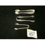 A PAIR OF STERLING SILVER SUGAR TONGS; SHEFFIELD 1916; DECORATIVE ARMS, A SMALL PAIR OF STERLING