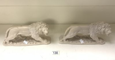 TWO MOULDED RESIN LIONS; 28 X 16CM