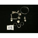 A SILVER CHARM BRACELET; MAKERS MARK H.G & S; WITH VARIOUS CHARMS INCLUDING A STORK AND A SCARECROW,