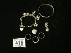 A SILVER CHARM BRACELET; MAKERS MARK H.G & S; WITH VARIOUS CHARMS INCLUDING A STORK AND A SCARECROW,