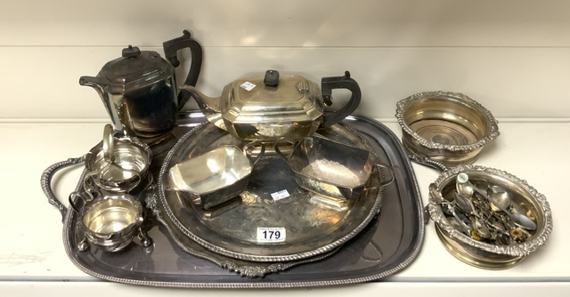 QUANTITY OF SILVER-PLATE INCLUDES TRAYS. TEA AND COFFEE SET, WINE COASTERS, PLATED SPOONS AND MORE