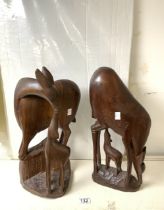 TWO CARVED AFRICAN FIGURES OF ANIMALS WITH THEIR FAWN; 46CM