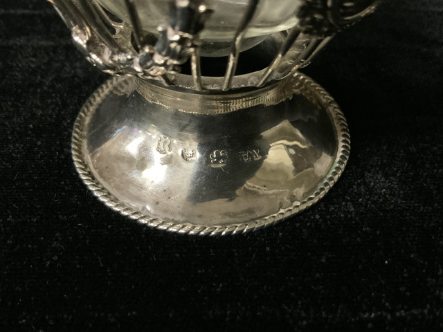 A GEORGE III STERLING SILVER SUGAR BASKET; MAKERS MARK WH LONDON 1772; ROPE TWIST SWING HANDLE AND - Image 3 of 4