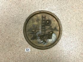 A VINTAGE CIRCULAR WALL PLAQUE / CHARGER, EMBOSSED WITH OCTOPUS PLAYING MUSICAL INSTRUMENTS, HOLDING