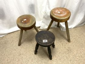 THREE ANTIQUE MILKING STOOLS