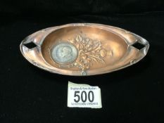 AN EDWARDIAN COMMEMORATIVE COPPER PIN TRAY; WITH REGISTERED DESIGN NUMBER 383760; EMBOSSED WITH
