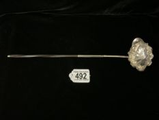 AN ANTIQUE WHITE METAL TODDY LADLE; FLUTED BOWL AND TWISTED HORN HANDLE; LENGTH 34CM