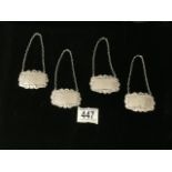 A SET OF FOUR STERLING SILVER WINE / SPIRIT LABELS; LONDON 1973-1975; RECTANGULAR FORM WITH SHELL;