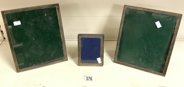 A PAIR OF STERLING SILVER MOUNTED PHOTOGRAPH FRAMES; BY HAMPTON UTILITIES; BIRMINGHAM 1984;