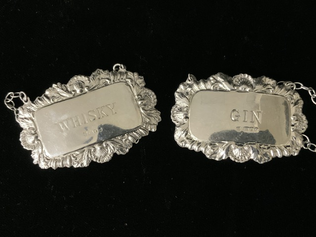 A SET OF FOUR STERLING SILVER WINE / SPIRIT LABELS; LONDON 1973-1975; RECTANGULAR FORM WITH SHELL; - Image 3 of 4