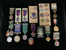 A QUANTITY OF METAL AND ENAMEL BADGES, VARIOUS AHPES AND TITLES, INCLUDING; EQUITABLE FRIENDLY