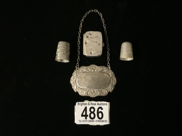A STERLING SILVER SPIRIT LABEL; BIRMINGHAM 1988; EMBOSSED FOLIATE AND SHELL BORDER; ENGRAVED '