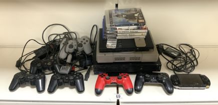 TWO PLAYSTATION 2; ONE BEING SLIMLINE; ALSO PAYSTATION 1 INCLUDES CONTROLLERS AND GAMES