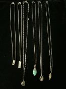 SIX SILVER NECKLACES, WITH VARIOUS PENDANTS, MARKED 925, EACH WITH A DIFFERENT SHELL OR STONE IN