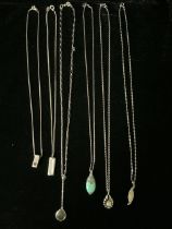 SIX SILVER NECKLACES, WITH VARIOUS PENDANTS, MARKED 925, EACH WITH A DIFFERENT SHELL OR STONE IN