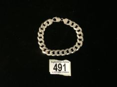 AN ITALIAN CURB LINK BRACELET; INCUSE STAMPED 925 WITH IMPORT MARK FOR LONDON; WEIGHT 39 GRAMS