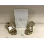 A PAIR OF RUSSELL & BROMLEY GOLD WEDGE HEEL SLIP ON SHOES; SIZE 38 UK 5; TEXTURED SIDES AND FABRIC