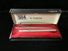 A BOXED PARKER PEN AND PENCIL; NIB MISSING AND ANOTHER PARKER PEN