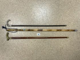 THREE WALKING STICKS; BRASS; ONE HAVING SECRET GLASS DRINKING TUBE