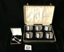 A CASED SET OF SIX STERLING SILVER NAPKIN RINGS BY F.H. ADAMS & CO; BIRMINGHAM 1928; PLAIN FORM;
