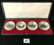 A BOXED SET OF FOUR STERLING SILVER CIRCULAR DISHES BY S. GARRARD; LONDON 1922; ONE ALSO STAMPED