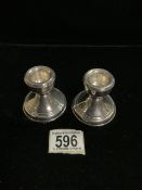 A PAIR OF STERLING SILVER DWARF CANDLESTICKS, SHEFFIELD 1980, CIRCULAR FORM, REEDED BORDERS,