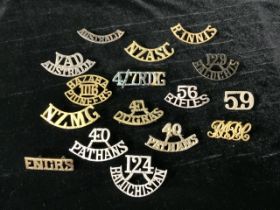 A QUANTITY OF METAL MILITARY SHOULDER TITLES, INCLUDING HAZARA PIONEERS, PATHANS, RIFLES, NZASC