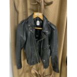 BLACK LEATHER JACKET BY JONATHAN A LOGAN. SIZE 8 - 10. DAMGE TO SLEEVE LINING A/F.