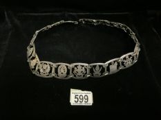 A VINTAGE MALAYSIAN WHITE METAL BELT, EACH SECTION SHAPED AND ENGRAVED WITH THE STATES OF SINGAPORE,